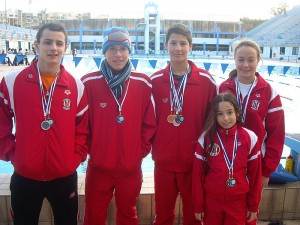 Neptunes swimmers who won medals in Berlin from left to right: Julian Harding, Michael Umnov, Neil Muscat, Amy Micallef and young Mya Azzopardi. The medNeptunes swimmers who won medals in Berlin from left to right: Julian Harding, Michael Umnov, Neil Muscat, Amy Micallef and young Mya Azzopardi.al winners